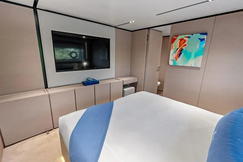 Slide: The Image of Luxurious bedroom interior on 2022 Custom Line Navetta 33 yacht with modern decor. - 84