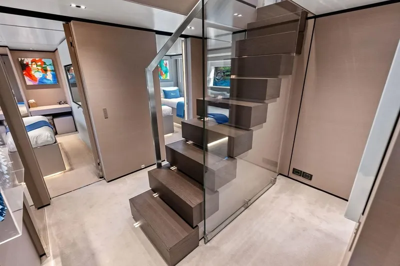 Slide: The Image of Luxurious interior of 2022 Custom Line Navetta 33 yacht with modern staircase and elegant decor. - 79