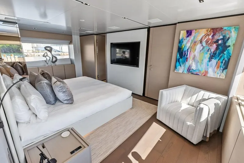 Slide: The Image of Luxurious bedroom interior on 2022 Custom Line Navetta 33 yacht with modern decor and artwork. - 74