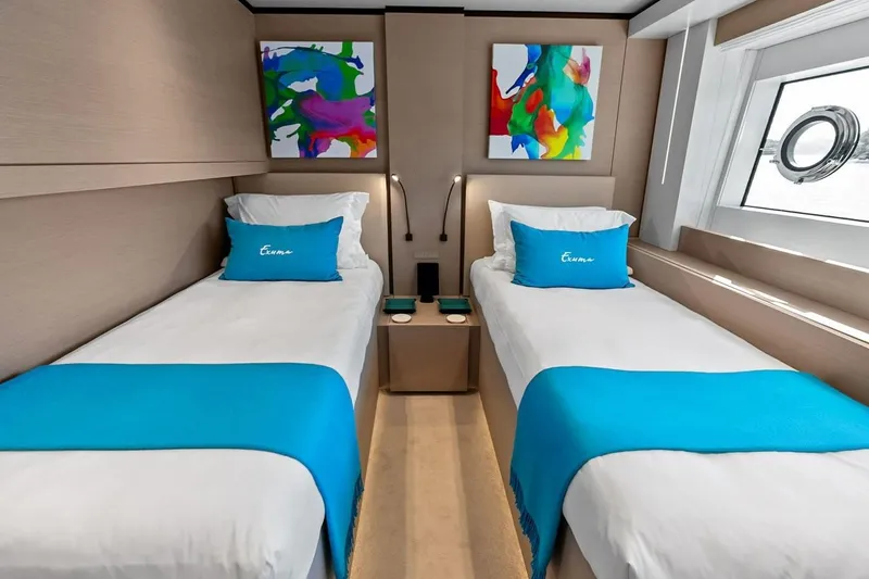 Slide: The Image of Luxurious twin cabin on 2022 Custom Line Navetta 33 yacht with vibrant decor. - 89