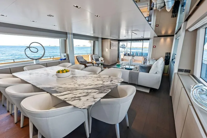 Slide: The Image of Luxurious interior of 2022 Custom Line Navetta 33 yacht with elegant dining and seating areas. - 61