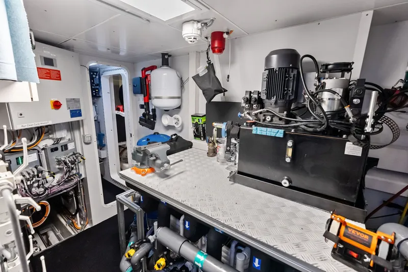 Slide: The Image of Engine room of 2022 Custom Line Navetta 33 yacht, featuring advanced machinery and equipment. - 105