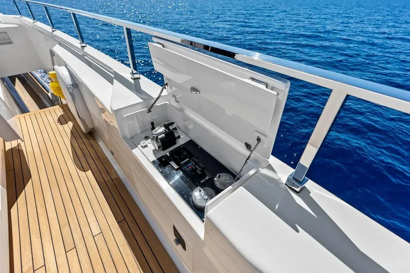 Slide: The Image of Luxury yacht Custom Line Navetta 33, 2022 model, featuring a sleek outdoor kitchen setup. - 39