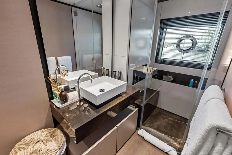 Slide: The Image of Luxurious bathroom on Custom Line Navetta 33 yacht, featuring modern sink and elegant decor, 2022 model. - 85