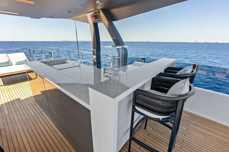 Slide: The Image of Luxurious outdoor bar on 2022 Custom Line Navetta 33 yacht with ocean view. - 22