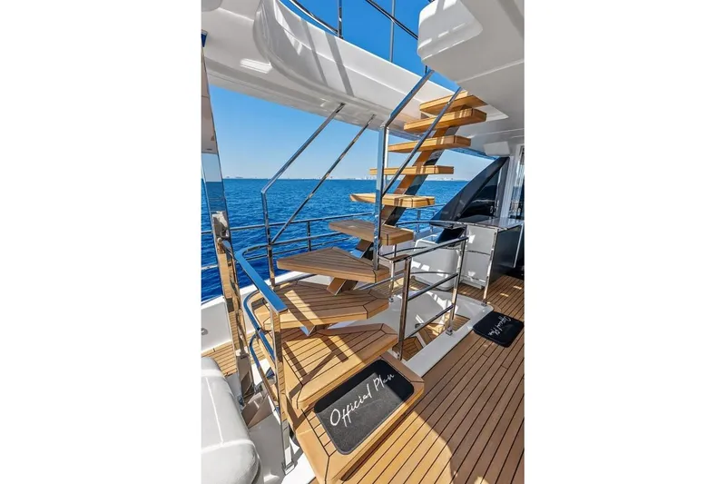 Slide: The Image of Luxurious 2022 Custom Line Navetta 33 yacht with elegant wooden staircase and ocean view. - 26