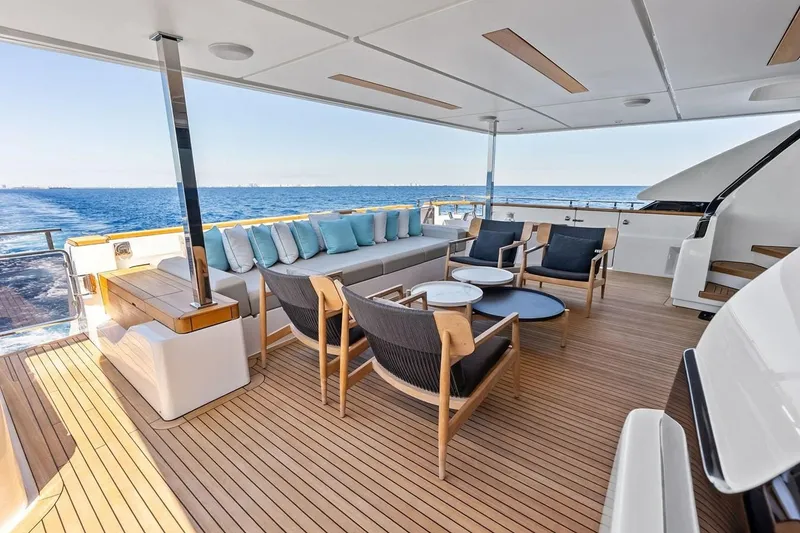Slide: The Image of Luxurious 2022 Custom Line Navetta 33 yacht deck with elegant seating and ocean view. - 56