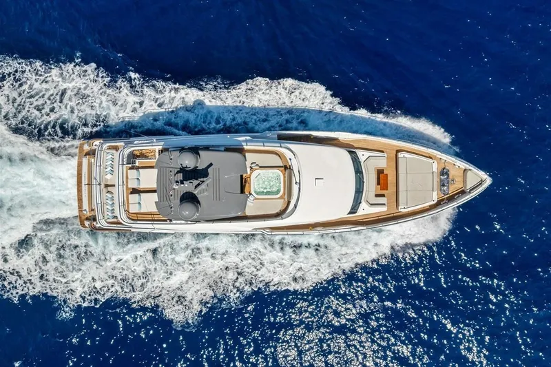 Slide: The Image of Aerial view of 2022 Custom Line Navetta 33 yacht cruising on blue ocean waters. - 15