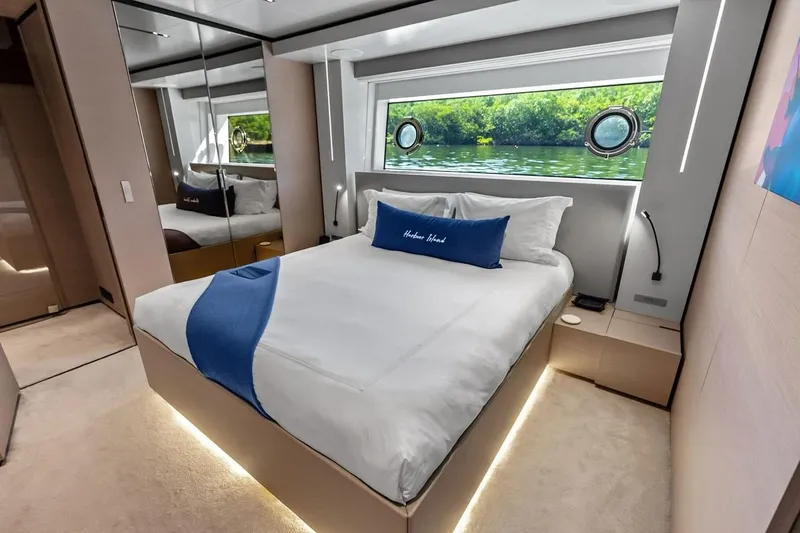 Slide: The Image of Luxurious bedroom interior of 2022 Custom Line Navetta 33 yacht with scenic window view. - 80