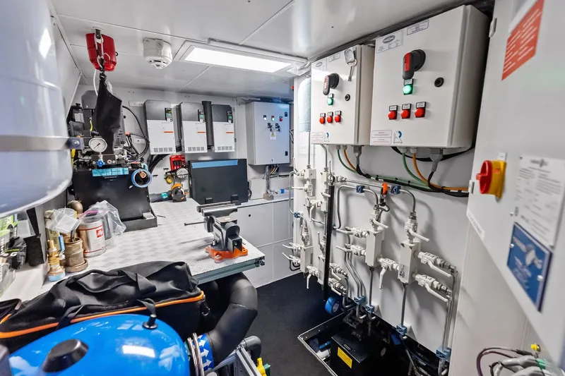 Slide: The Image of Engine room of 2022 Custom Line Navetta 33 yacht with control panels and equipment. - 104
