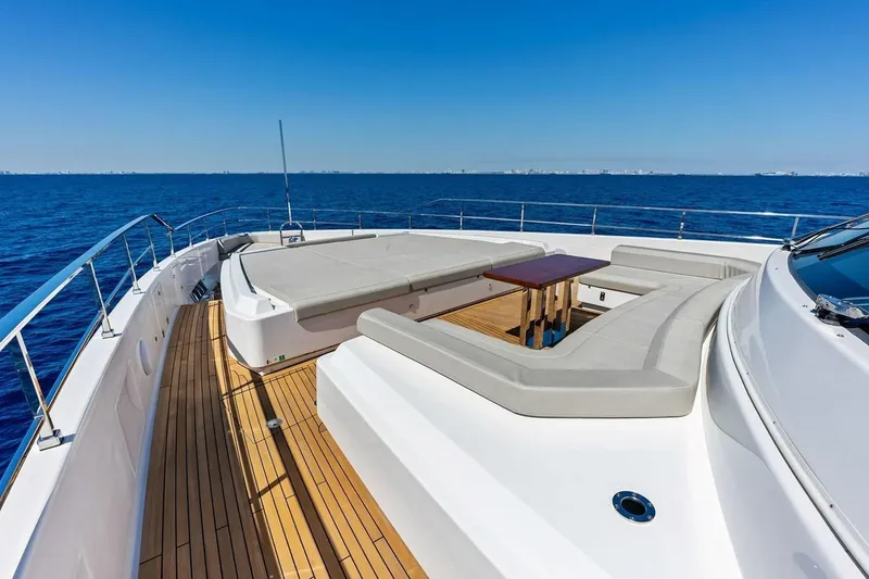 Slide: The Image of Luxurious 2022 Custom Line Navetta 33 yacht deck with seating, overlooking the ocean. - 34