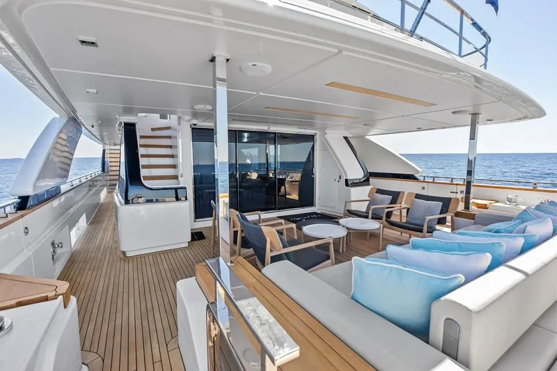 Slide: The Image of Luxurious 2022 Custom Line Navetta 33 yacht deck with elegant seating and ocean view. - 55