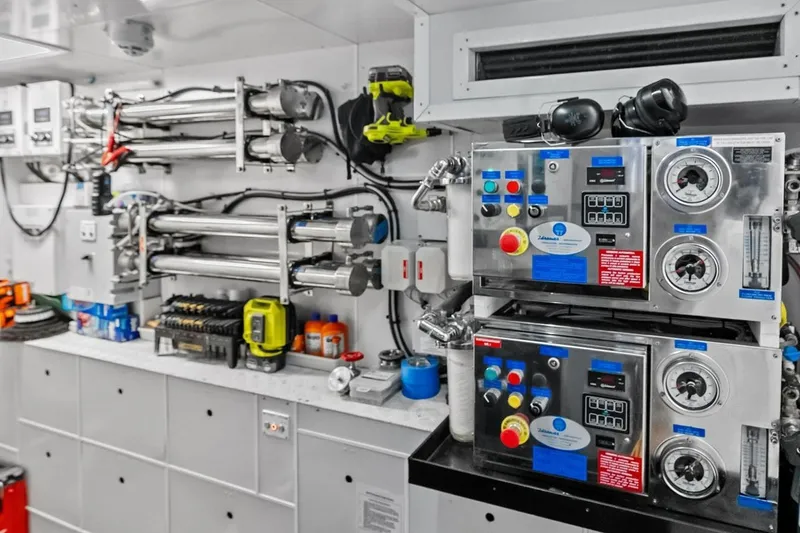 Slide: The Image of Engine room of 2022 Custom Line Navetta 33 yacht with advanced machinery and controls. - 77