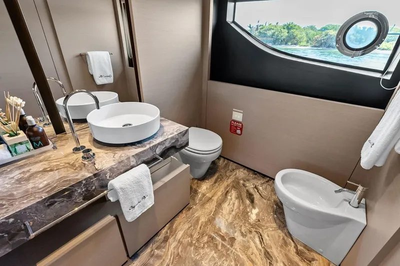 Slide: The Image of Luxurious bathroom on Custom Line Navetta 33 yacht, featuring marble countertop and ocean view. - 76