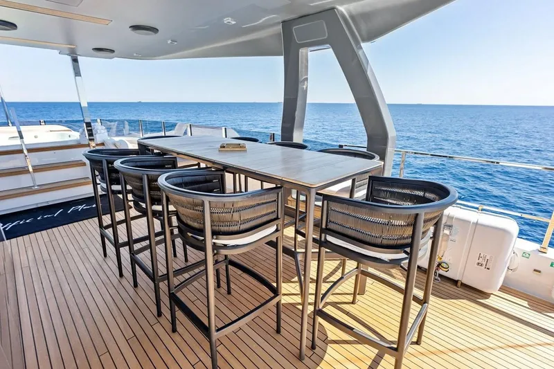 Slide: The Image of Luxury yacht deck with modern seating, Custom Line Navetta 33, 2022 model, ocean view. - 23