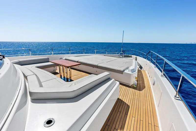 Slide: The Image of Luxurious 2022 Custom Line Navetta 33 yacht deck with seating, overlooking the ocean. - 35