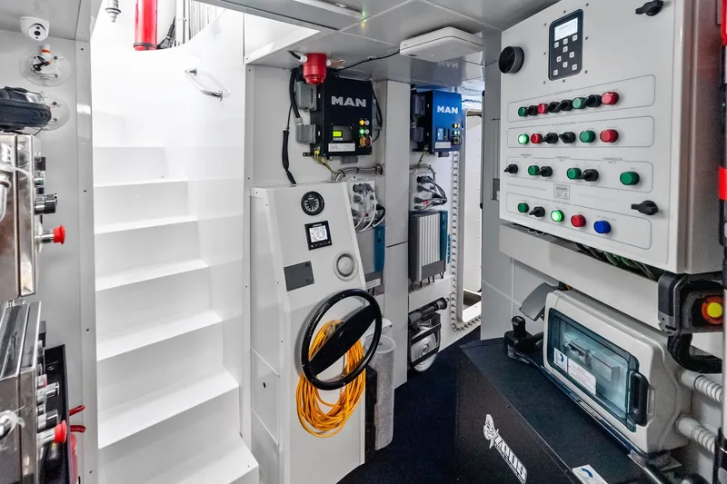 Slide: The Image of Engine room of 2022 Custom Line Navetta 33 yacht with control panels and equipment. - 101