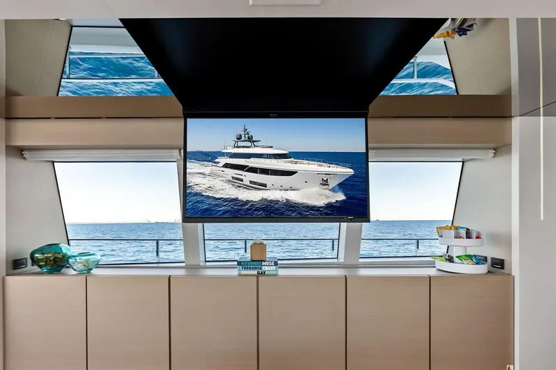 Slide: The Image of Luxurious interior of 2022 Custom Line Navetta 33 yacht with ocean view and TV display. - 42