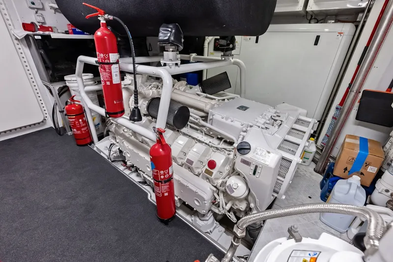 Slide: The Image of Engine room of 2022 Custom Line Navetta 33 yacht with fire extinguishers and equipment. - 98