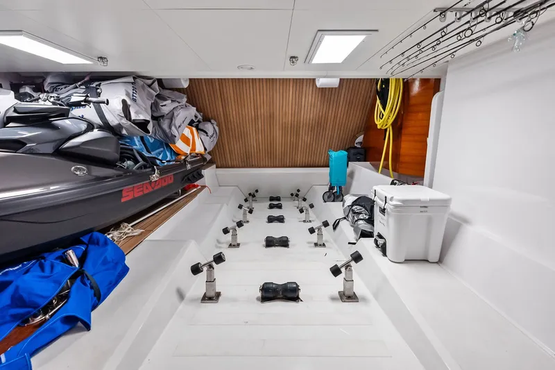 Slide: The Image of Storage area of 2022 Custom Line Navetta 33 yacht with jet ski and equipment. - 102
