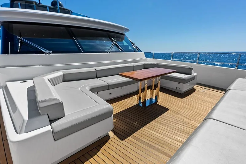 Slide: The Image of Luxurious 2022 Custom Line Navetta 33 yacht deck with elegant seating and ocean view. - 36