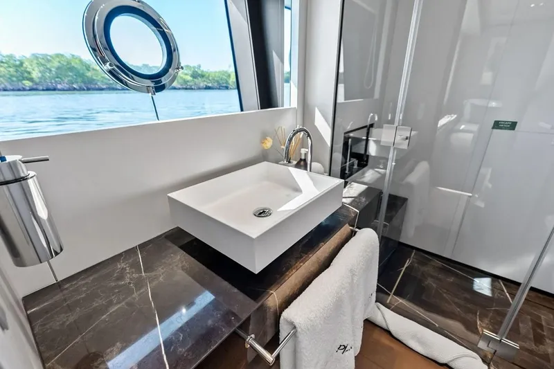 Slide: The Image of Luxurious bathroom on 2022 Custom Line Navetta 33 yacht with modern sink and ocean view. - 91