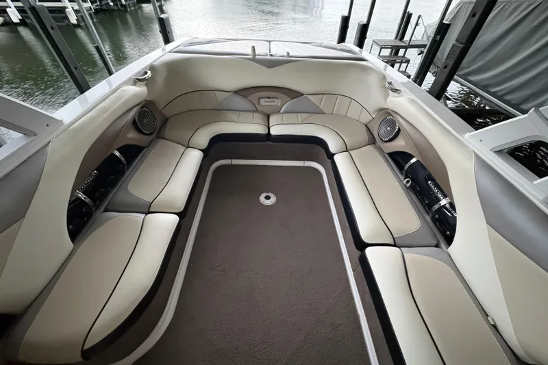 Slide: The Image of Interior of 2011 Malibu Wakesetter 247 LSV boat with spacious seating and speakers. - 11