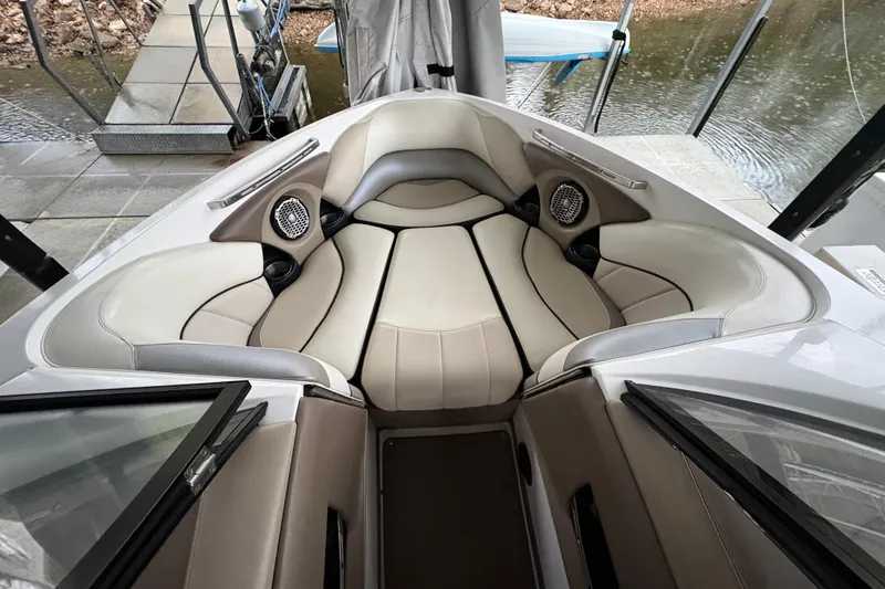 Slide: The Image of Interior of a 2011 Malibu Wakesetter 247 LSV boat with cushioned seating. - 12