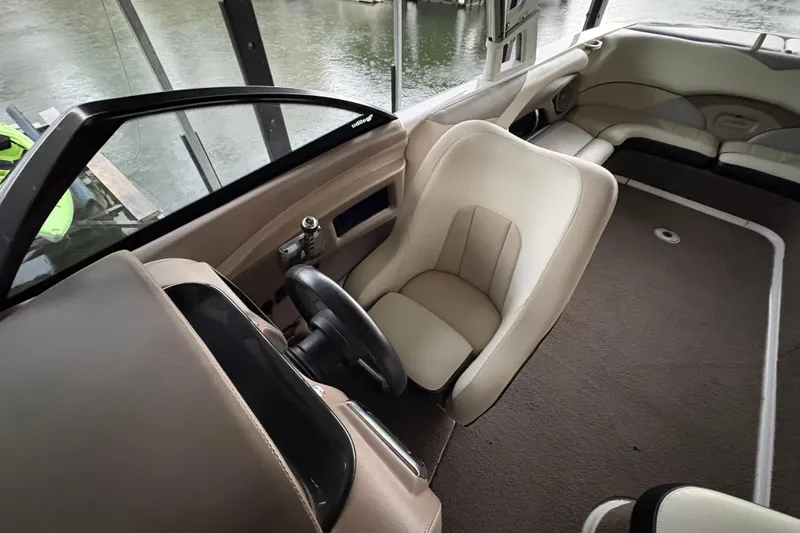 Slide: The Image of Interior of a 2011 Malibu Wakesetter 247 LSV boat with beige seating. - 15