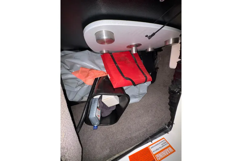 Slide: The Image of Interior storage of 2011 Malibu Wakesetter 247 LSV with life jacket and accessories. - 24