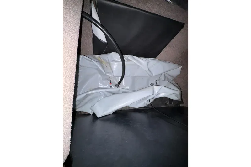 Slide: The Image of Interior view of a 2011 Malibu Wakesetter 247 LSV with visible wiring and components. - 25