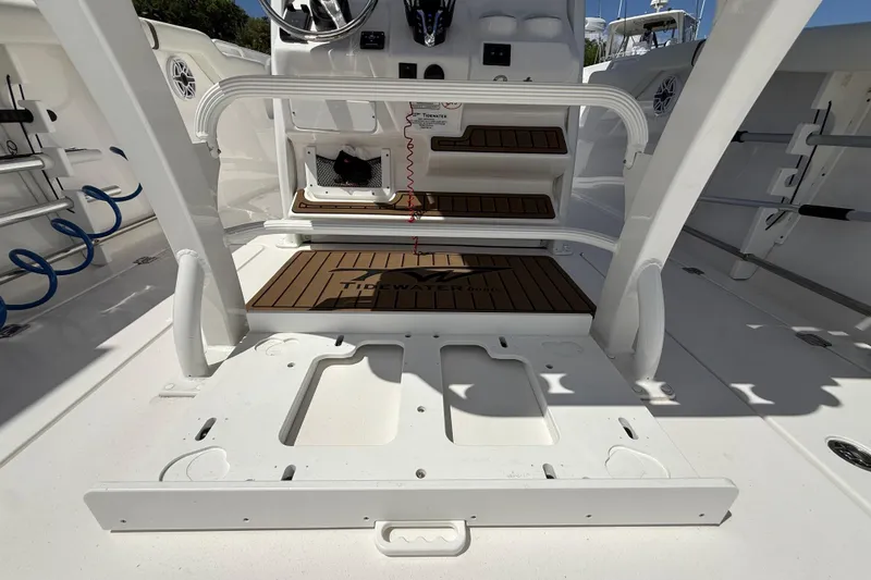 Slide: The Image of 2025 Tidewater 272 CC Adventure boat interior with seating and control panel. - 21