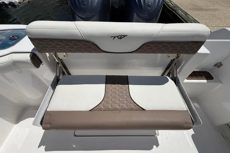 Slide: The Image of 2025 Tidewater 272 CC Adventure boat seat with stylish brown and white upholstery. - 36