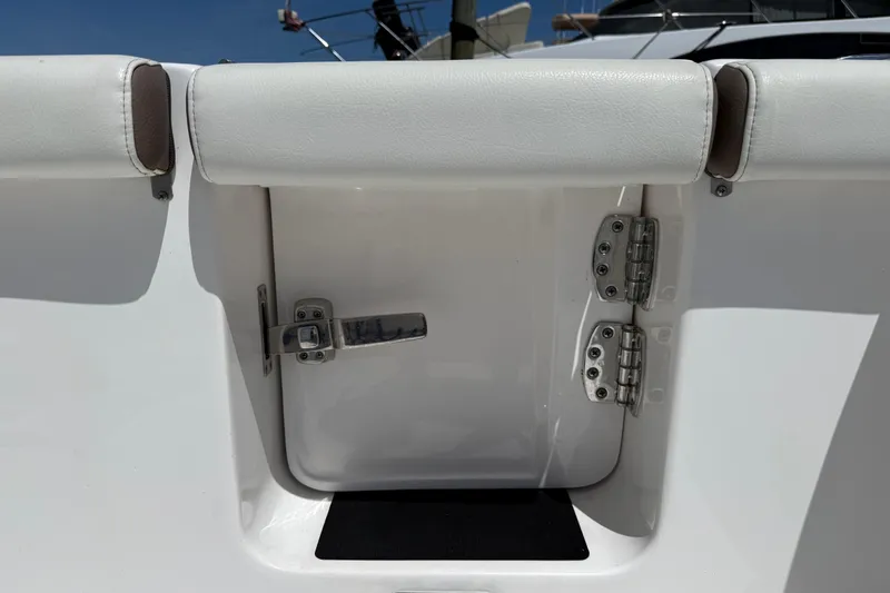 Slide: The Image of 2025 Tidewater 272 CC Adventure boat hatch with stainless steel hinges and latch. - 41