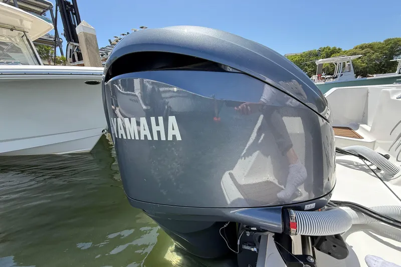 Slide: The Image of 2025 Tidewater 272 CC Adventure with Yamaha outboard engine, docked in sunny marina. - 45