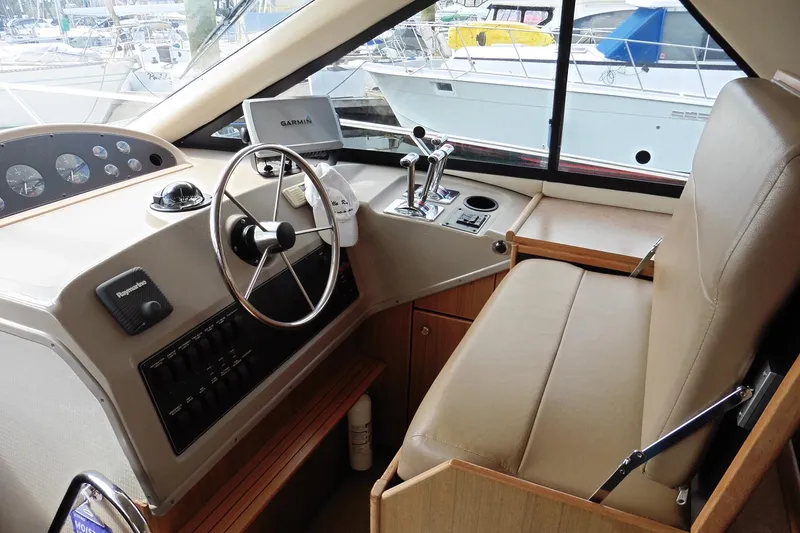 Slide: The Image of Interior helm of 2000 Bayliner 3988 Command Bridge Motoryacht with steering wheel and controls. - 11