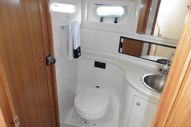 Slide: The Image of Bathroom interior of 2000 Bayliner 3988 Command Bridge Motoryacht with sink and toilet. - 14