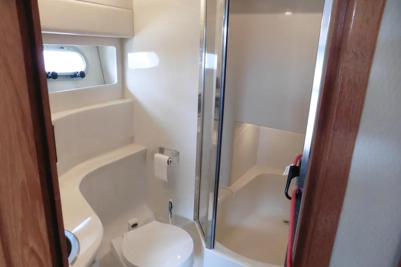 Slide: The Image of Bathroom interior of 2000 Bayliner 3988 Command Bridge Motoryacht, featuring shower and toilet. - 17