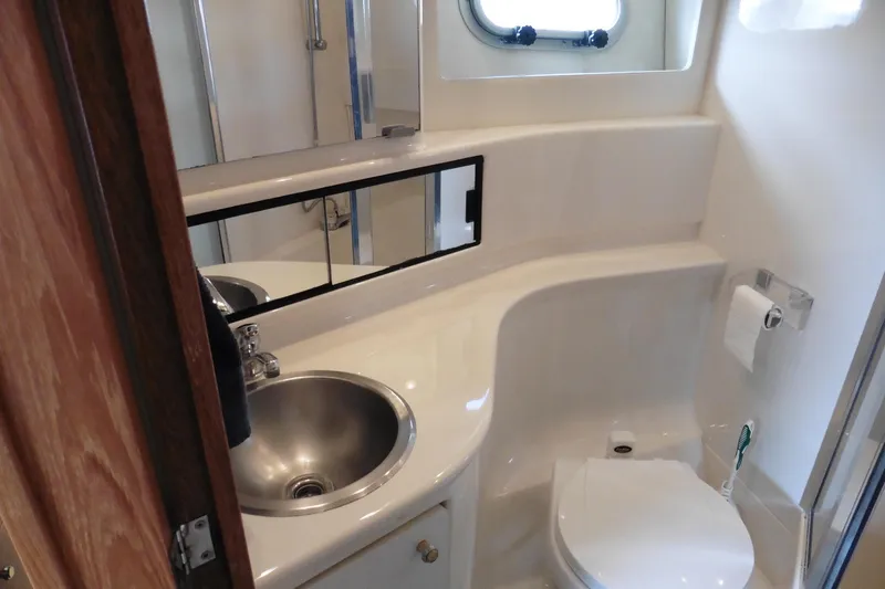 Slide: The Image of Bathroom interior of 2000 Bayliner 3988 Command Bridge Motoryacht with sink and toilet. - 18