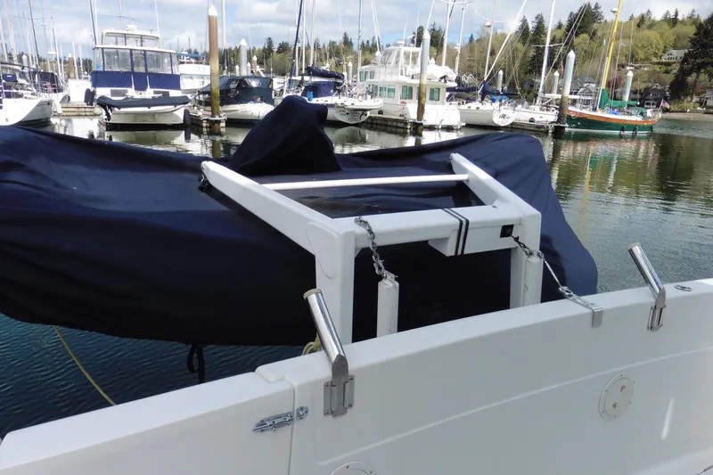 Slide: The Image of Bayliner 3988 Command Bridge Motoryacht 2000 at marina, covered and docked. - 2