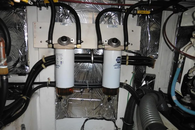 Slide: The Image of Engine room of 2000 Bayliner 3988 Command Bridge Motoryacht with fuel filters and hoses. - 29