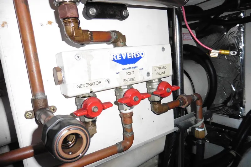 Slide: The Image of Engine room valves and pipes on a 2000 Bayliner 3988 Command Bridge Motoryacht. - 30