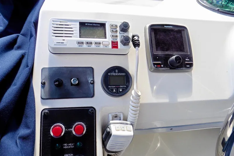Slide: The Image of Control panel of 2000 Bayliner 3988 Command Bridge Motoryacht with radio and navigation equipment. - 35