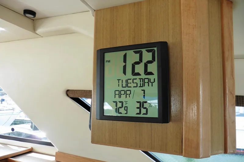 Slide: The Image of Digital clock display inside 2000 Bayliner 3988 Command Bridge Motoryacht, showing time, date, temperature, and humidity. - 37