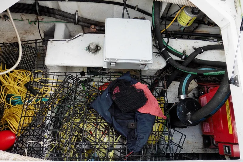 Slide: The Image of Engine compartment of 2000 Bayliner 3988 Command Bridge Motoryacht with ropes and equipment. - 43