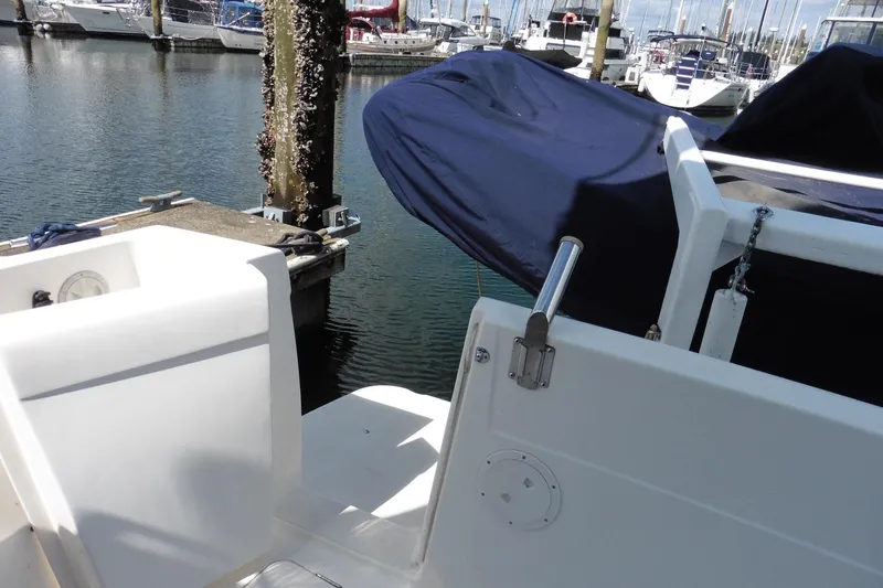 Slide: The Image of 2000 Bayliner 3988 Command Bridge Motoryacht docked at marina, covered and secured. - 47
