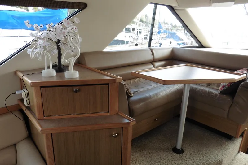 Slide: The Image of Interior of 2000 Bayliner 3988 Command Bridge Motoryacht with seating and table. - 8