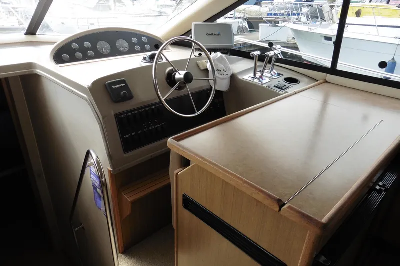 Slide: The Image of Interior helm of 2000 Bayliner 3988 Command Bridge Motoryacht with steering wheel and controls. - 9