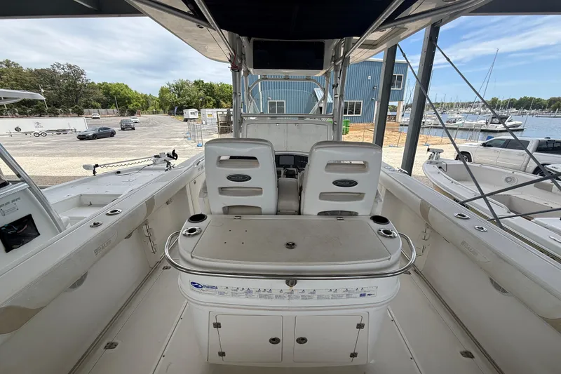 Slide: The Image of 2004 Boston Whaler 320 Outrage boat interior with seating and control panel. - 19