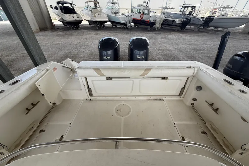 Slide: The Image of 2004 Boston Whaler 320 Outrage boat interior with twin 300 horsepower engines. - 22